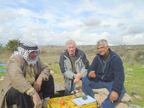 The Demolished Fruit Stand, Witnessed by B'Tselem. Photo showing the fruit stand owner, author Mel Earley and Abdulkarim Sadi, who works with B’Tselem,  an Israeli human rights organization
